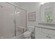Modern bathroom with a glass-enclosed shower, a vanity with a sink, and tiled floors at 2077 Amalfi Pl, Apex, NC 27502