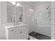 Bathroom showcasing a tiled shower, vanity with mirror, and modern fixtures at 2077 Amalfi Pl, Apex, NC 27502