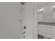 Shower features white subway tile, bronze fixtures, and a built-in shampoo niche at 2077 Amalfi Pl, Apex, NC 27502
