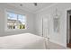 Bedroom with a view of the neighborhood, neutral walls, and a cozy atmosphere at 2077 Amalfi Pl, Apex, NC 27502