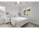 Bright bedroom with carpet, ceiling fan, and a view of the neighborhood at 2077 Amalfi Pl, Apex, NC 27502