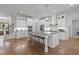 Modern kitchen with a large center island, stainless steel appliances, and ample counter space at 2077 Amalfi Pl, Apex, NC 27502