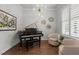 Comfortable living room showcasing a piano and stylish decor at 2077 Amalfi Pl, Apex, NC 27502