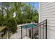 Backyard featuring a luxurious pool, spa, and lush green landscaping at 2077 Amalfi Pl, Apex, NC 27502