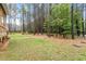 Expansive backyard with mature trees, providing privacy and a serene setting at 210 Sorrel Dr, Franklinton, NC 27525