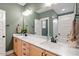 Bathroom featuring double vanity, modern fixtures, and a well-lit mirror at 210 Sorrel Dr, Franklinton, NC 27525