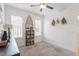 A charming bedroom bathed in natural light, featuring decorative wall art at 210 Sorrel Dr, Franklinton, NC 27525