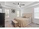 Bright bedroom boasts a ceiling fan, tray ceiling, and neutral décor at 210 Sorrel Dr, Franklinton, NC 27525