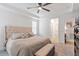 Bright primary bedroom with large bed, tufted headboard, and neutral tones at 210 Sorrel Dr, Franklinton, NC 27525