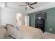 Comfortable bedroom showcases tray ceiling, ceiling fan, and stylish accent wall at 210 Sorrel Dr, Franklinton, NC 27525
