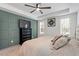 Comfortable bedroom showcases tray ceiling, ceiling fan, and stylish accent wall at 210 Sorrel Dr, Franklinton, NC 27525