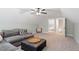 Bonus room showcases a comfortable sectional sofa, ottoman, and ample space at 210 Sorrel Dr, Franklinton, NC 27525