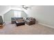 Spacious bonus room features neutral carpet and a comfortable sectional sofa at 210 Sorrel Dr, Franklinton, NC 27525