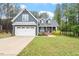 Charming two-story home with a well-manicured lawn and attached two-car garage at 210 Sorrel Dr, Franklinton, NC 27525