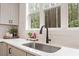 Bright kitchen sink with large window overlooking a private wooded lot at 210 Sorrel Dr, Franklinton, NC 27525