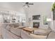 Open concept living room flowing into the kitchen with a fireplace at 210 Sorrel Dr, Franklinton, NC 27525