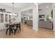 Open-concept living space with hardwood floors, modern decor, and lots of natural light at 210 Sorrel Dr, Franklinton, NC 27525