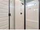 The bathroom has an elegantly tiled shower with a modern glass enclosure at 210 Sorrel Dr, Franklinton, NC 27525