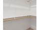 A walk-in closet with white shelving and carpeted floor at 210 Sorrel Dr, Franklinton, NC 27525