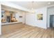 Open dining area showcasing breakfast bar, modern lighting, and view into the kitchen at 2106 University Dr, Durham, NC 27707