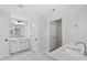 Bright bathroom featuring double sinks, white cabinets, and marble floors at 2178 Pink Peony Circle Lot 167 Cir, Durham, NC 27703