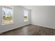 Bright bedroom with hardwood floors and two windows offering plenty of natural light at 2178 Pink Peony Circle Lot 167 Cir, Durham, NC 27703