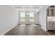 Elegant dining area features a chandelier, hardwood floors, and abundant natural light at 2178 Pink Peony Circle Lot 167 Cir, Durham, NC 27703