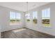 Bright dining room with three large windows offering natural light and views of the outdoors at 2178 Pink Peony Circle Lot 167 Cir, Durham, NC 27703