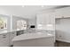 Spacious kitchen with a large island, quartz countertops, and stainless steel appliances at 2178 Pink Peony Circle Lot 167 Cir, Durham, NC 27703
