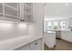 Close-up of the stylish white cabinets and countertop with view of the kitchen at 2178 Pink Peony Circle Lot 167 Cir, Durham, NC 27703