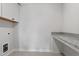 Functional laundry area with granite countertop and modern cabinets at 2178 Pink Peony Circle Lot 167 Cir, Durham, NC 27703