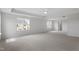 Spacious primary bedroom with plush carpeting, tray ceiling, and natural light at 2178 Pink Peony Circle Lot 167 Cir, Durham, NC 27703