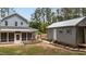 Spacious backyard featuring a screened porch and an outbuilding, perfect for outdoor entertaining and storage at 225 Sacred Fire Rd, Louisburg, NC 27549