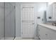 Bathroom featuring modern vanity with framed mirror and glass shower at 225 Sacred Fire Rd, Louisburg, NC 27549