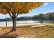Picturesque view of the community beach area with volleyball court and lake access at 225 Sacred Fire Rd, Louisburg, NC 27549