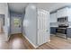 Entryway with white front door, hardwood floors, and view of kitchen at 225 Sacred Fire Rd, Louisburg, NC 27549