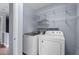 Laundry room featuring shelving and modern washer and dryer at 225 Sacred Fire Rd, Louisburg, NC 27549