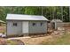 Well-maintained outbuilding featuring a metal roof, providing functional and aesthetically pleasing outdoor storage at 225 Sacred Fire Rd, Louisburg, NC 27549