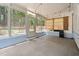 Sunroom featuring ample natural light, neutral walls, and concrete flooring at 225 Sacred Fire Rd, Louisburg, NC 27549
