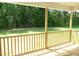 View from the home's covered back porch showing backyard greenery at 235 Eason Creek Way, Clayton, NC 27527