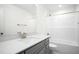 Bathroom featuring a vanity with a large mirror and tub with shower at 235 Eason Creek Way, Clayton, NC 27527