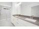 Bathroom featuring double vanity and a glass enclosed shower at 235 Eason Creek Way, Clayton, NC 27527