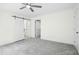 Spacious bedroom featuring neutral carpet and modern sliding doors at 235 Eason Creek Way, Clayton, NC 27527