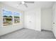 Bedroom with a large window allowing for plenty of natural light at 235 Eason Creek Way, Clayton, NC 27527