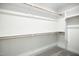 Walk-in closet with shelves and racks for optimal storage at 235 Eason Creek Way, Clayton, NC 27527