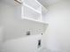 A spacious laundry room features built in shelving at 235 Eason Creek Way, Clayton, NC 27527