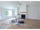 Bright living room with fireplace, built-in cabinets, and large windows at 235 Eason Creek Way, Clayton, NC 27527