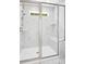 Modern glass-enclosed shower featuring white marble tiles at 235 Eason Creek Way, Clayton, NC 27527
