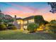 Expansive backyard with a manicured lawn, brick facade and stone steps, ideal for outdoor enjoyment at 238 Michelangelo Way, Cary, NC 27518