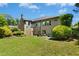 Spacious backyard featuring a well-maintained lawn, patio seating and manicured landscaping at 238 Michelangelo Way, Cary, NC 27518